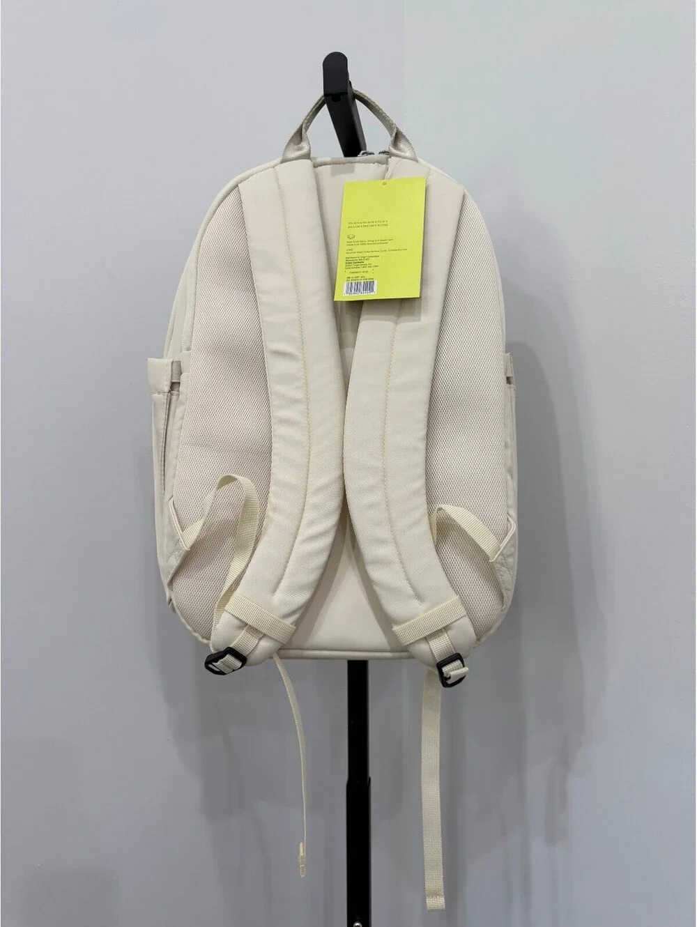 All in Motion Minimalist Cream Backpack with Side Pockets and Padded Straps